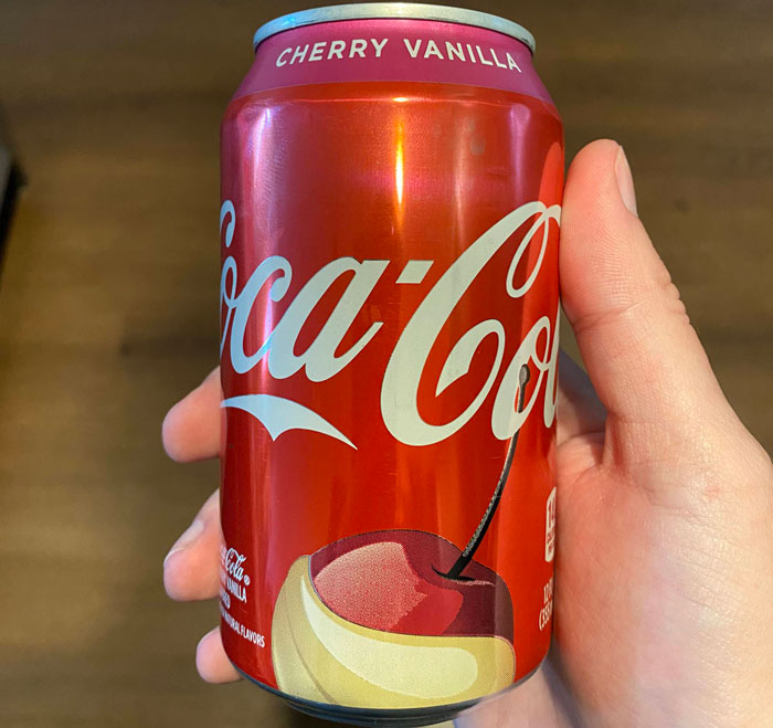 Is Cherry Vanilla Coke made with cherries and vanilla mixed together, or is it made with vanilla cherries?

*vanilla cherries???*