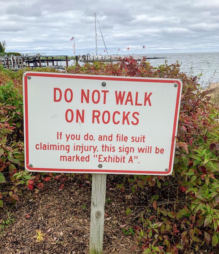hilarious signs for stupid people - sign - Do Not Walk On Rocks If you do, and file suit claiming injury, this sign will be marked "Exhibit A".