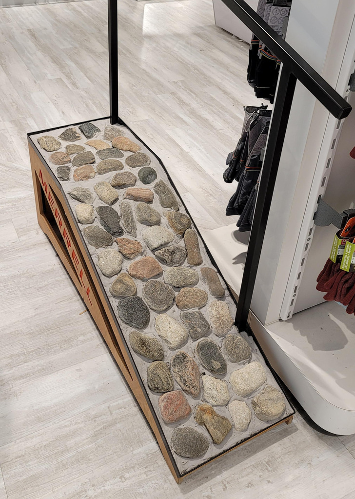 “Outdoors store near me has a rock ramp for testing hiking shoe fit and grip.”