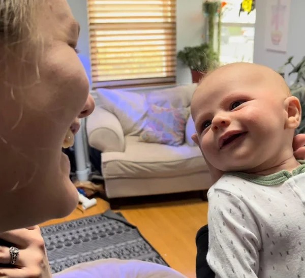 My son, smiling at his mom for the first time