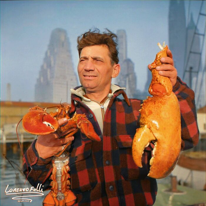 colorized photos from history - New York, Dock Stevedore At The Fulton Fish Market Holding Giant Lobster Claws,1943 May-June.