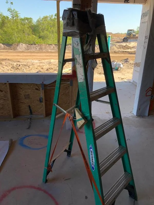 This ladder on my job site that is held together with a strip of house wrap & a strap.