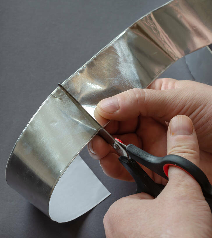 You can avoid discarding blunt scissors with a little help from aluminum foil. Start by tearing a piece of foil measuring at about 12-inches, and fold it a few times until it’s 6 layers thick. Use the scissors to cut through the foil several times to sharpen it. Note that this technique will only work for slightly dull scissors, not for damaged blades.