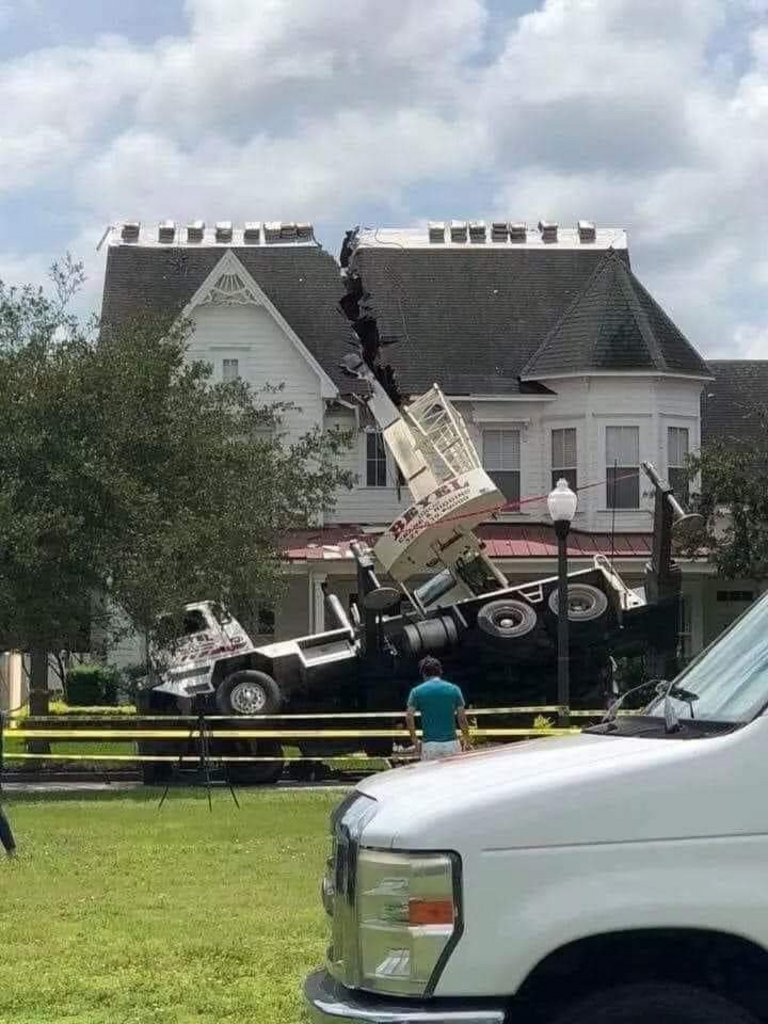 They were lifting shingles and one of the truck supports was sitting on sodden grass.