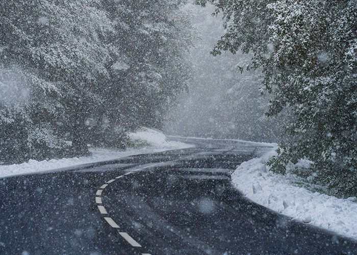 I actually had this happen to me yesterday. I was driving home through the mountains and drove into a freak May snowstorm. I was on a road with a canyon on my right side, mountain on my left, and my wipers weren't doing a damn thing to help me with the snow. I couldn't see a f*****g thing. My heart was beating so hard and I wanted to stop, but there were cars behind me and I couldn't so I had to keep just crawling forward. Finally got to a scenic overlook and was able to pull off. It was terrifying.