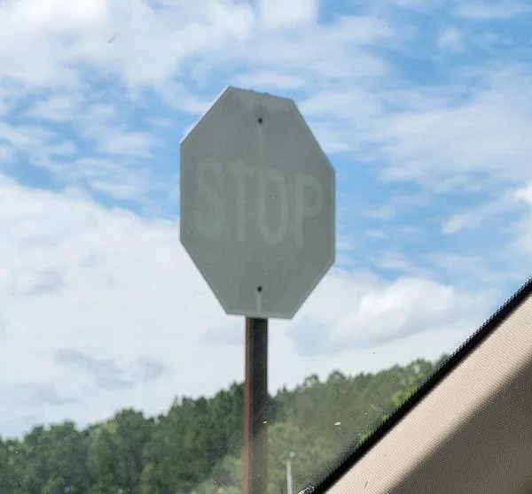 This extremely faded stop sign