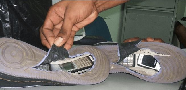 Shoes with hidden cell phones inside of them. 4 cell phones were found inside of the soles, which had been hollowed out.