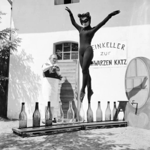 17-Year-Old Bianca Passarge From Hamburg Dances On Wine Bottles In A Cat Costume, 1958.