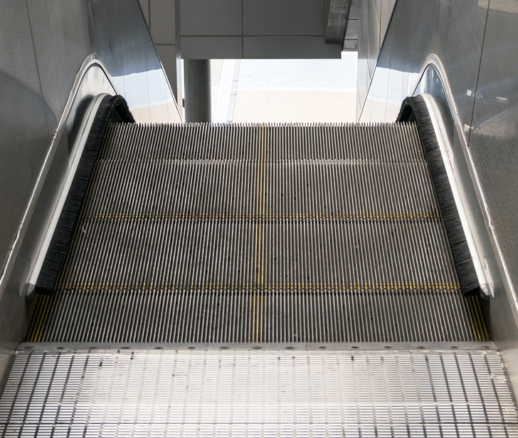 These brushes are not for cleaning your shoes — they are much more important than that. They act as shields between you and the edges of the escalator, minimizing accidents, such as stuck clothes or wedged accessories.