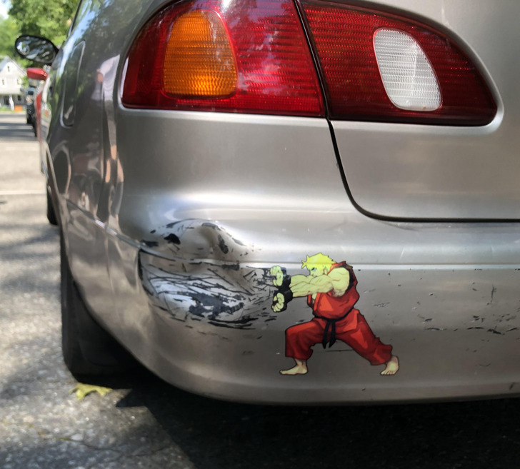 fascinating photos - car dent with clever bumper sticker