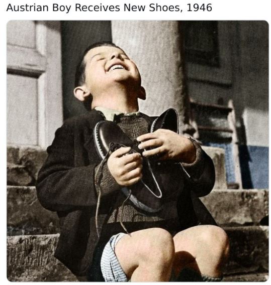 colorized historical photos - sirloin stockade - Austrian Boy Receives New Shoes, 1946