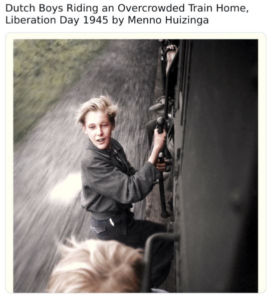 colorized historical photos - Monochrome photography - Dutch Boys Riding an Overcrowded Train Home, Liberation Day 1945 by Menno Huizinga