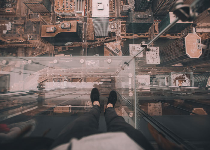 Late to the party. But- was touring Tower Bridge in London. There is a glass floor and I, in all of my infinite acrophobic wisdom, decided to give it a try. I put one foot on it, felt faint- which is typical for me, then put the other foot on it and immediately screeched and grabbed on to the COMPLETE AND TOTAL stranger next to me for dear life.

So, dear stranger, don’t be near me if I start to fall- I’m taking you with me.