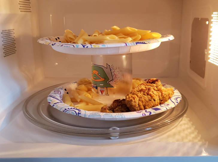 “My girlfriend came up with a crazy good microwave life hack for multiple plates. It heats up evenly this way.”