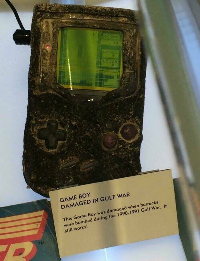 fascinating photos from history - gameboy survived nuke - Tm Scope Lejel Lines Game Boy Damaged In Gulf War This Game Boy was damaged when barracks were bombed during the 19901991 Gulf War. It still works!