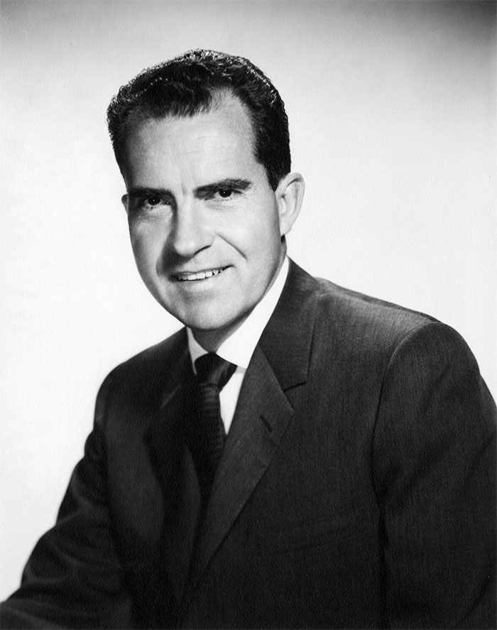 Richard Nixon. Won the 1972 election by a landslide, with only Minnesota and DC voting for McGovern, on the back of a strong economy. Two years later resigns in disgrace over Watergate, in the midst of stagflation, and his reputation has never been rehabilitated.
