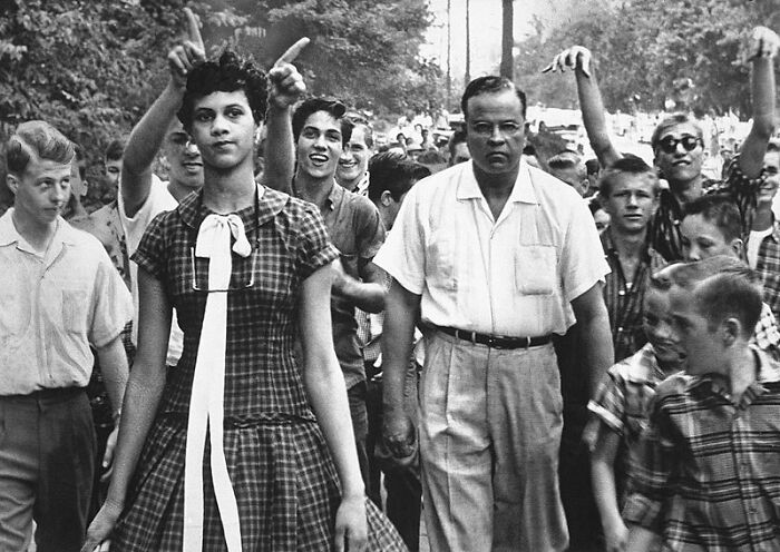 Dorothy Counts, The First Black Student To Attend An All-White School In The United States. Shown In This Photo Teased And Mocked By Her White Male Classmates