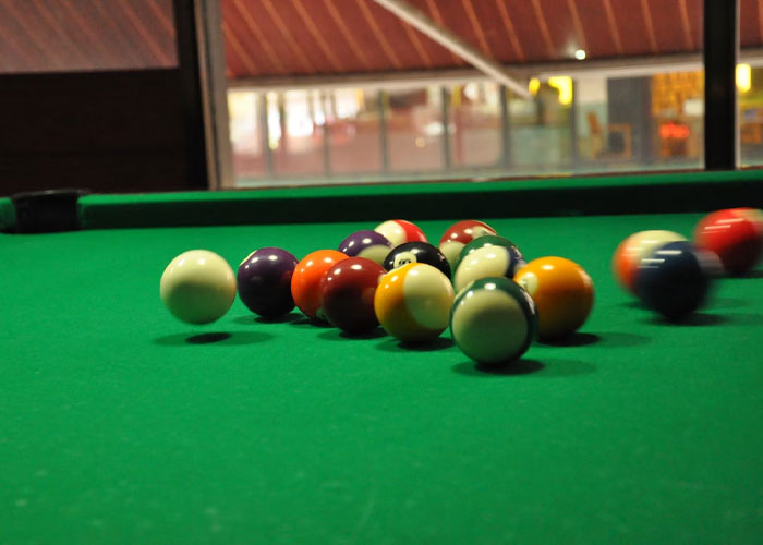 my wife's parents basement.

at the foot of the stairs was a pool table.

my wife (was my girlfriend at the time) and I went down to shoot some pool. as we got to the bottom step we saw 3 pool balls rolling around on the table. no one else was down there.