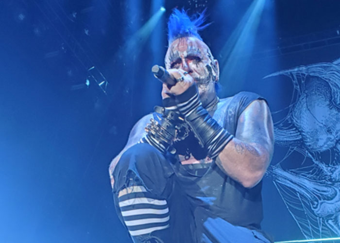 I got into a staring contest with the lead singer of Mudvayne, Chad Grey.

We were in a bar in Portland, Oregon. I looked at him, he looked at me and did that 'open eyes wide and stare intently' at me. I took my glasses off and mad dog stared at him. He grit his teeth, I made my eyes wince. Then we both kind of nodded and went back to our drinks.