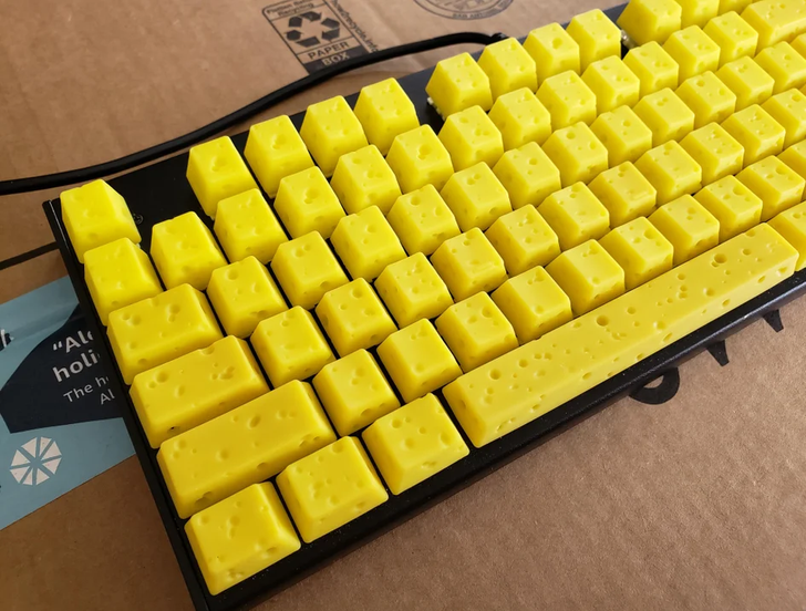 “Keyboard with cheese-styled keycaps”