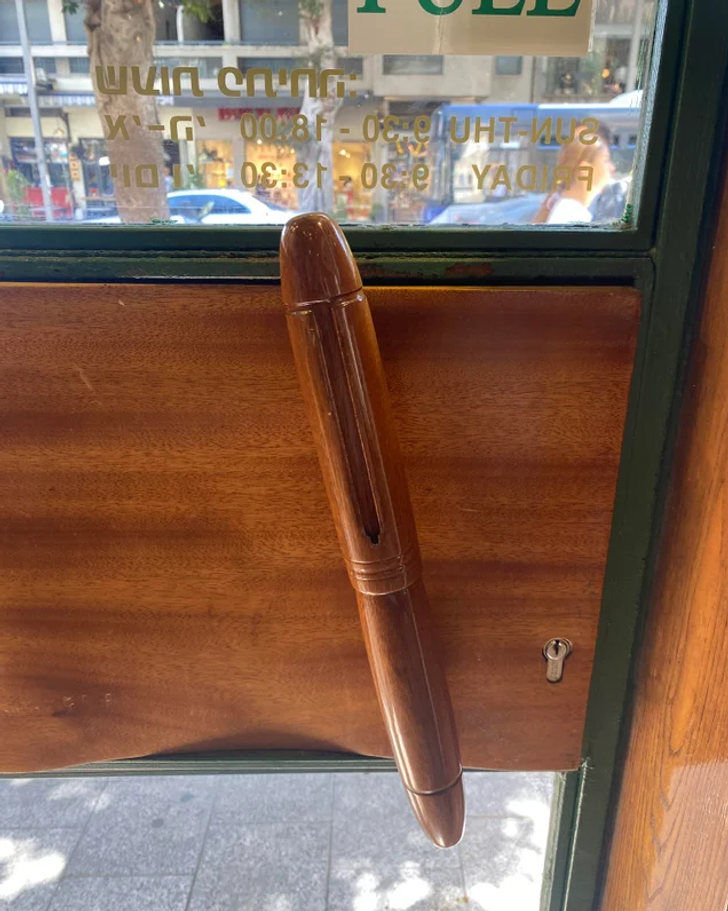 “The door handle in this pen shop is a pen.”