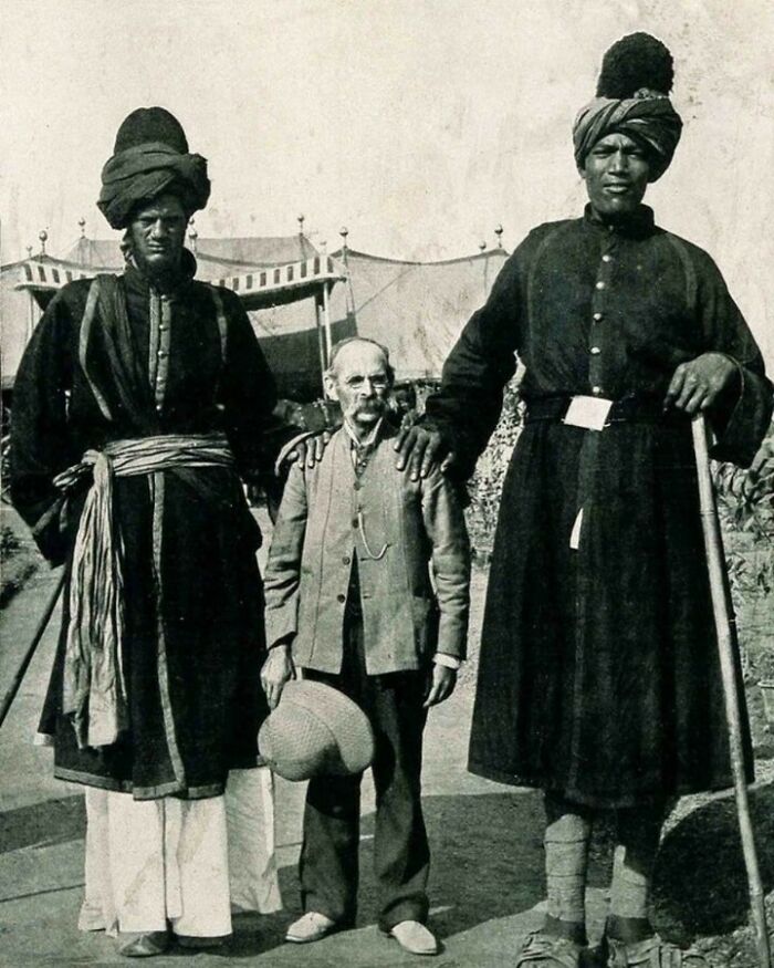 historical pictures - The Two Kashmir Giants Posing With The American Photographer James Ricalton, 1903
