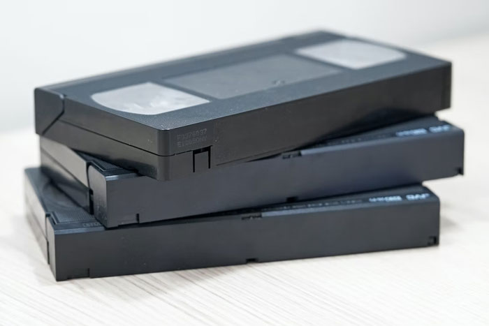 VHS tapes. I was 6 in 2002. They were at the end of their life, but most of what I watched up until then was on VHS.