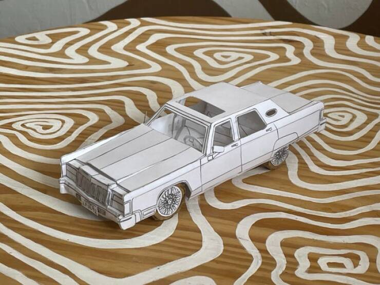 "I made a 1975 Lincoln Continental out of paper. All drawn and designed by hand. It even has rolling wheels!"