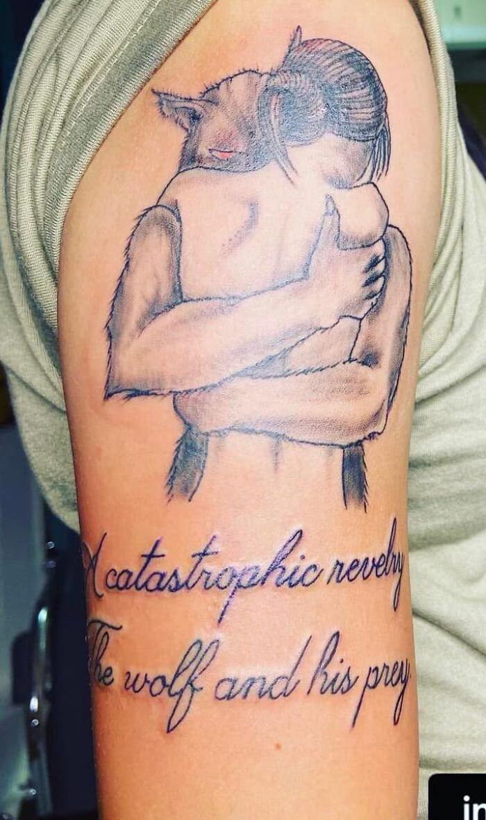 Bad Tattoos - tattoo - catastrophic novely wolf and his pray in