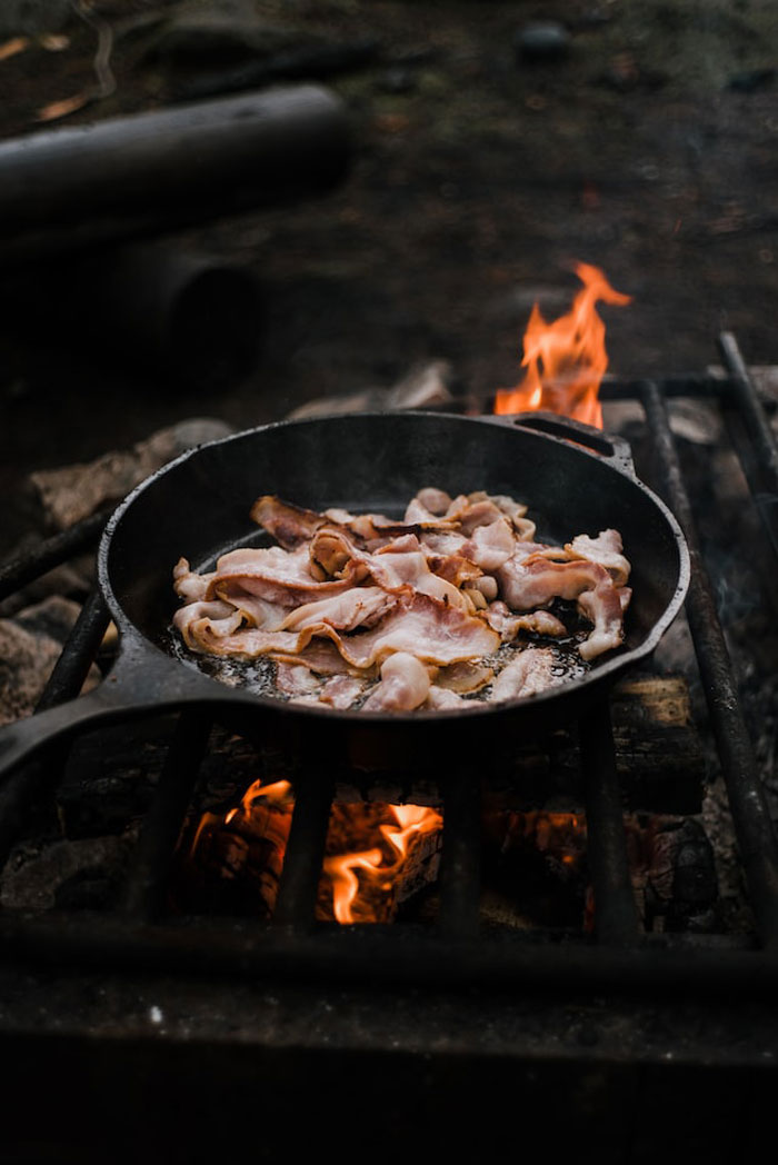 Frying bacon. I now bake @ 375 for 27 minutes on a cookie sheet covered with crinkled up aluminum foil. No mess perfect bacon every time