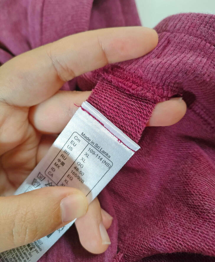 “The labels on this sweater are sewed onto small scraps of fabric, so it’s easier to cut them, and they don’t leave any itchy residue behind.”