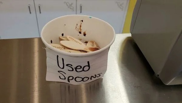 Holy shit guys, this ice cream store has a cup of sample spoons covered in FREE ice cream just sitting there