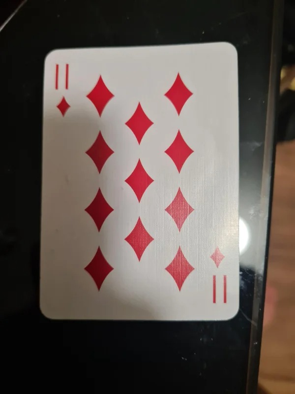 “Found an 11 of diamonds playing card on a walking trail.”