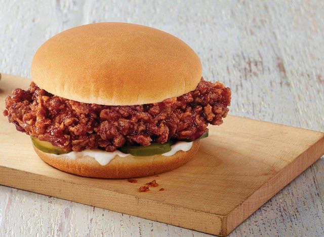 Worked at KFC for ~4 years. The BBQ sandwich is actually made from chicken too old and stale to give to the homeless shelters, so they soak it in BBQ sauce until it can be pulled and then they keep it on the heater for a month.