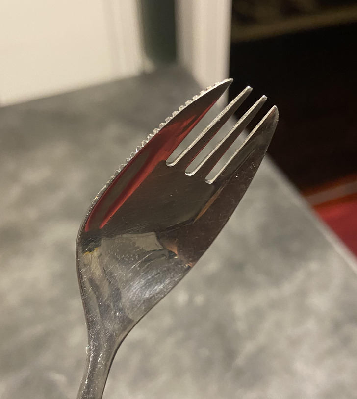 “This spork is made out of stainless steel and has a jagged knife edge on the side.”