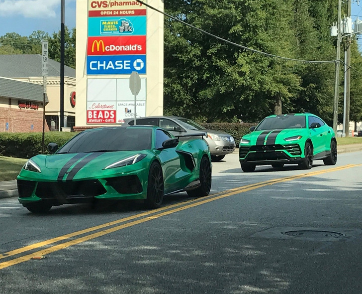 “A matching Chevy Corvette and Lamborghini Urus cruising through the neighborhood”