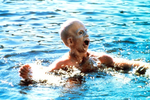 Ari Lehman wades in the water in a mask while waiting to terrify you with the final jump scare in Friday the 13th (1980):