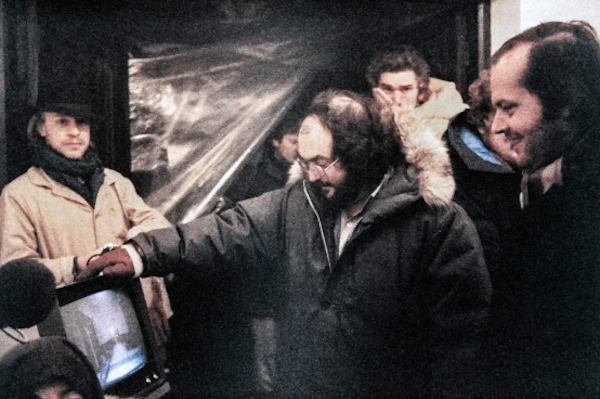 Director Stanley Kubrick, Jack Nicholson, and the whole crew try to stay warm on the set of The Shining (1980):