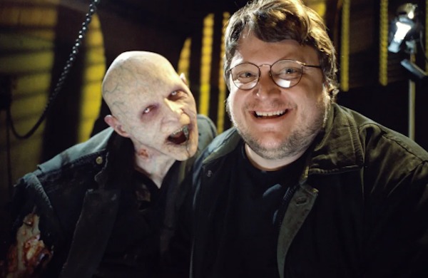 Director Guillermo del Toro makes a friend on the set of Blade II (2002):