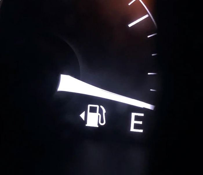 On the dashboard of your car, by the little gas pump picture, there is an arrow. It points either right or left, to whichever side your gas tank is on.