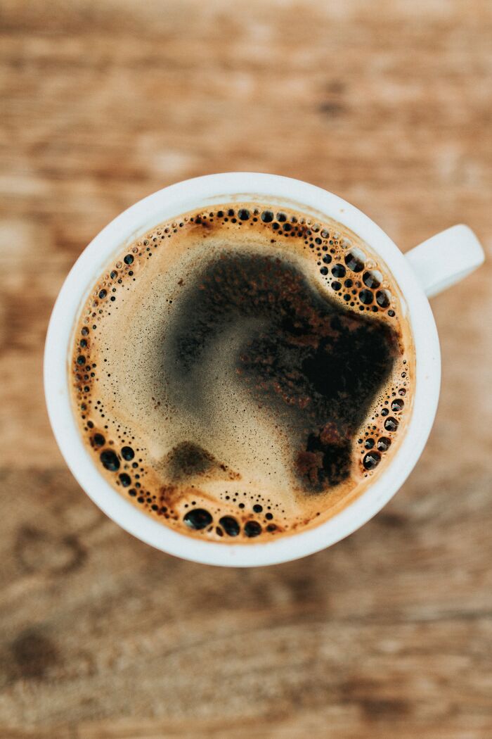 Caffeine is a banned substance by the NCAA. A urinary caffeine concentration exceeding 15 micrograms per milliliter (corresponding to ingesting about 500 milligrams, roughly 6 to 8 cups of brewed coffee, two to three hours before competition) results in a positive drug test.