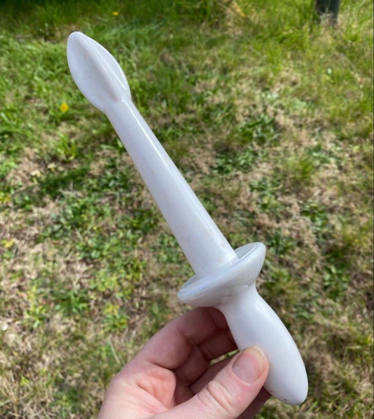 “Unusual white plastic kitchen utensil with a handle”

Answer: “Looks like it would be used to stir the contents in a blender. It inserts in the top to stir it.”