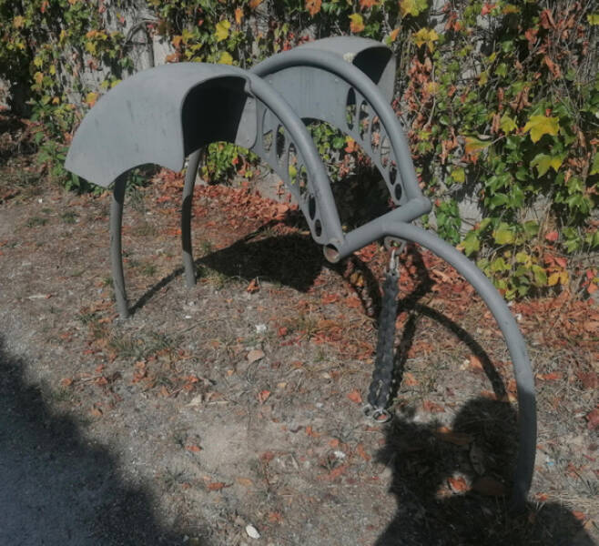 “Made entirely of metal, it was found in a residential area in France.”

Answer: "Looks kinda like a bike rack. The seat goes under the sheltered bit, so it stays dry."