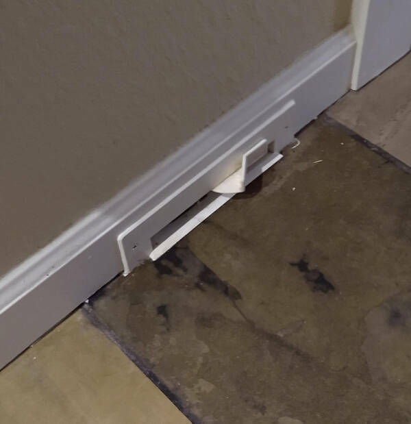 “A strange switch? In a baseboard outside the bathroom.”

Answer: "Solved, turns out these apartments used to have built-in vacuums, but no longer."