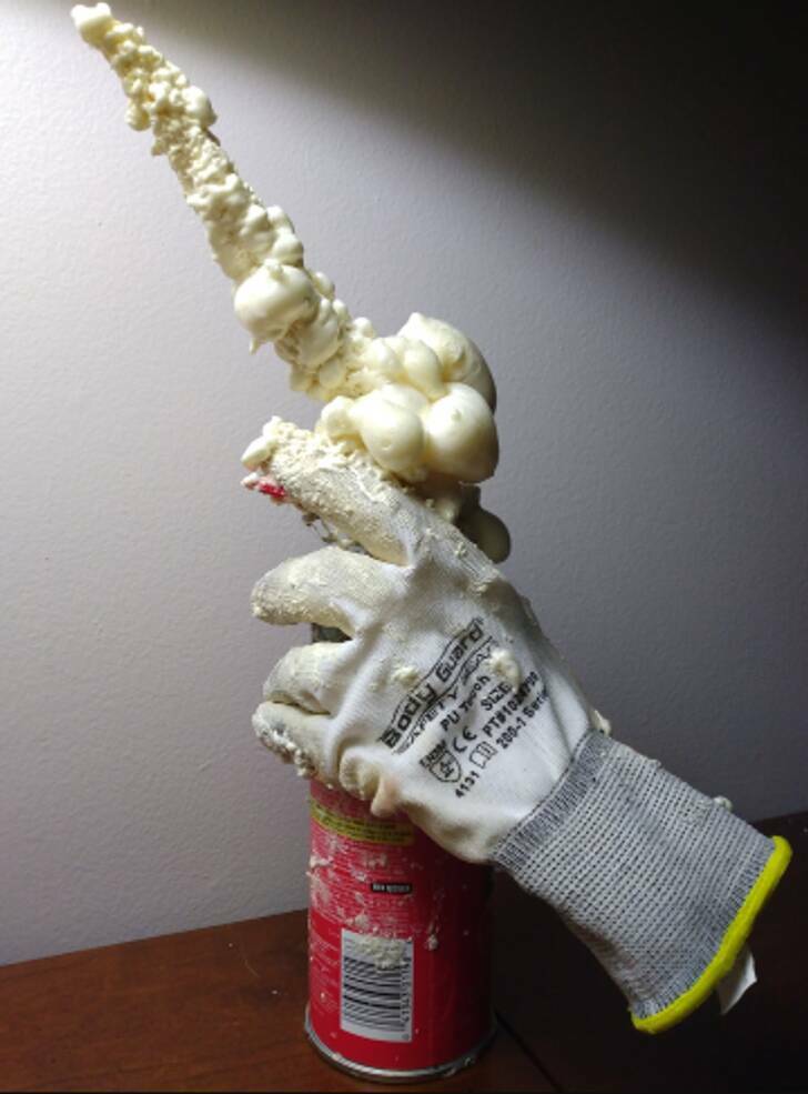 “The tube on my expanding foam can cracked, resulting in this mess. The glove is irremovable.”