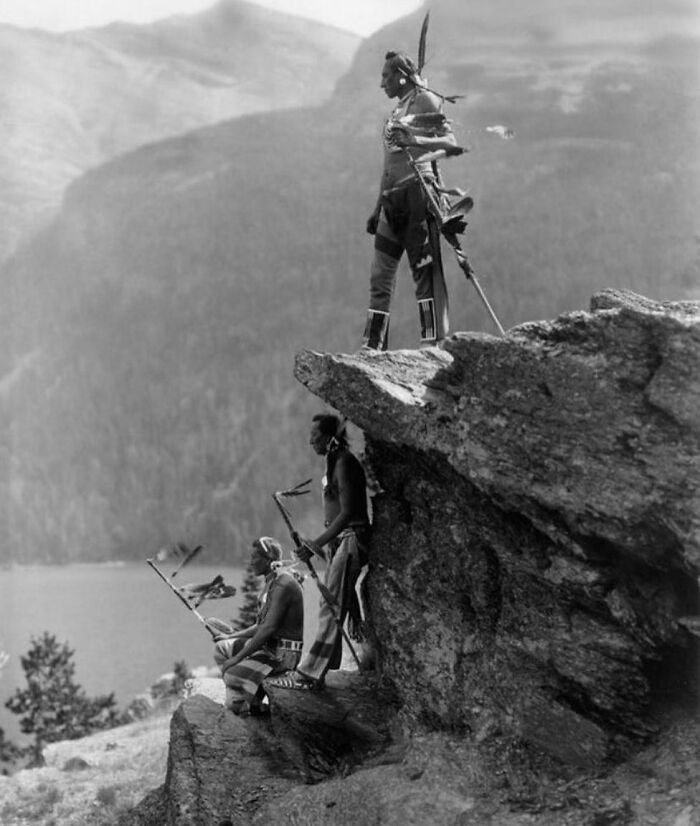 Blackfoot Native Americans Looking Out Over Glacier National Park In Montana