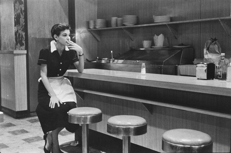 A Waitress in a Diner taking a Break, New York, 1955. By Elliott Erwitt