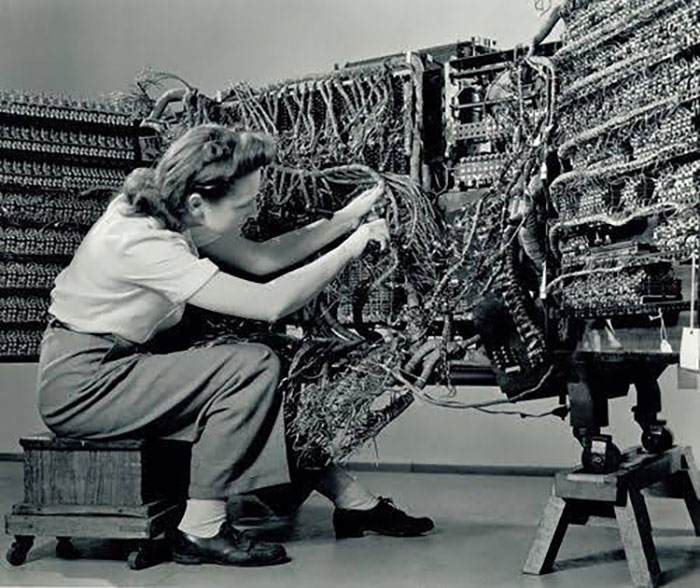 important historical pictures - engineer wiring an ibm computer in 1958