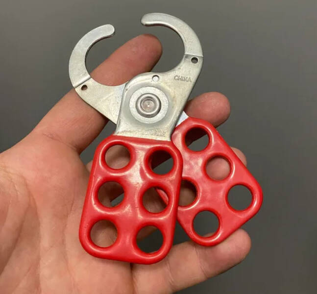 “What is this type of clamp used for? It doesn’t open more than this, and when closed, the holes collide perfectly.”

"That’s a gang lock for Lockout/Tagout. It’s placed on a breaker when many people are working with equipment to keep them safe."