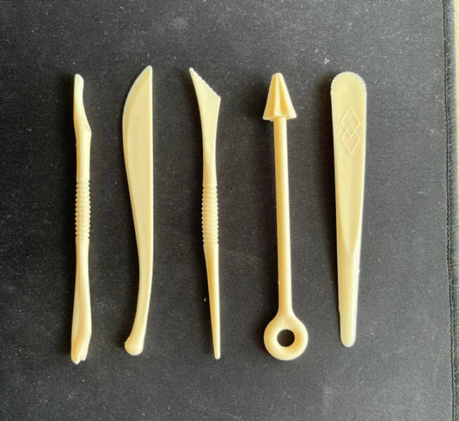 “I found this odd set of disposable cutlery in my new flat.”

"They’re clay modeling instruments or cake-decorating tools."